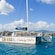 A private catamaran anchored in the water near Saint Thomas, with Guests swimming nearby